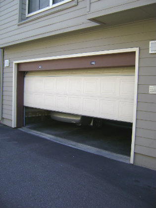 a broken garage door that needs repaired
